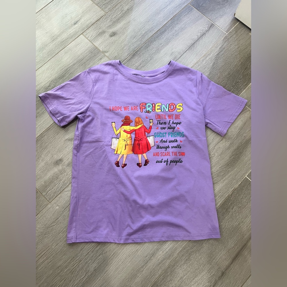 🔥3/$18🔥 NWOT Women’s Purple Graphic T-Shirt. Size medium.